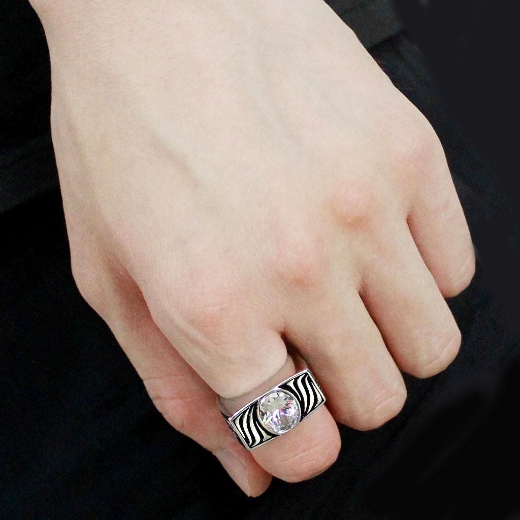 Alamode TK3620 high-polished stainless steel ring with AAA grade clear CZ gemstone, showcasing a sleek and shiny design.