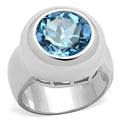 Sterling silver Alamode ring with a vibrant sea blue synthetic spinel gemstone, showcasing a sleek, polished design.